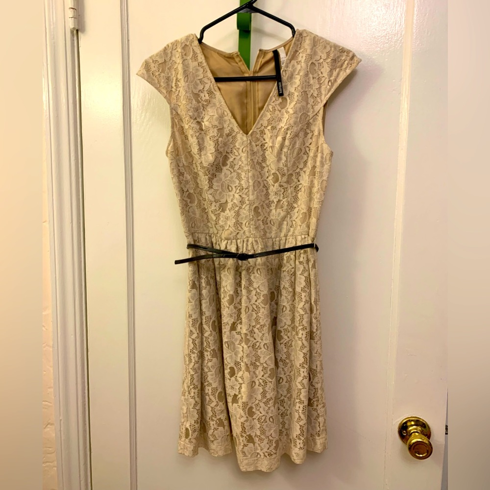 Lovely lace cocktail dress, cap sleeves, v- neck, belted and lined.